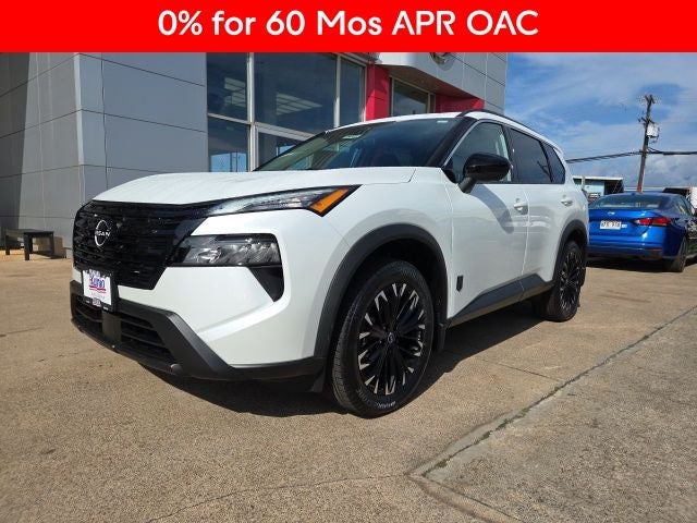 2026 Nissan Rogue Dark Armor in Everest White Pearl Tricoat — front three-quarter view