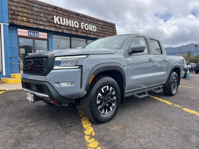 2023 Nissan Frontier PRO-4X in Boulder Gray Pearl — front three-quarter view